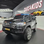 Kinderauto Toyota Land Cruiser politie 24 volt