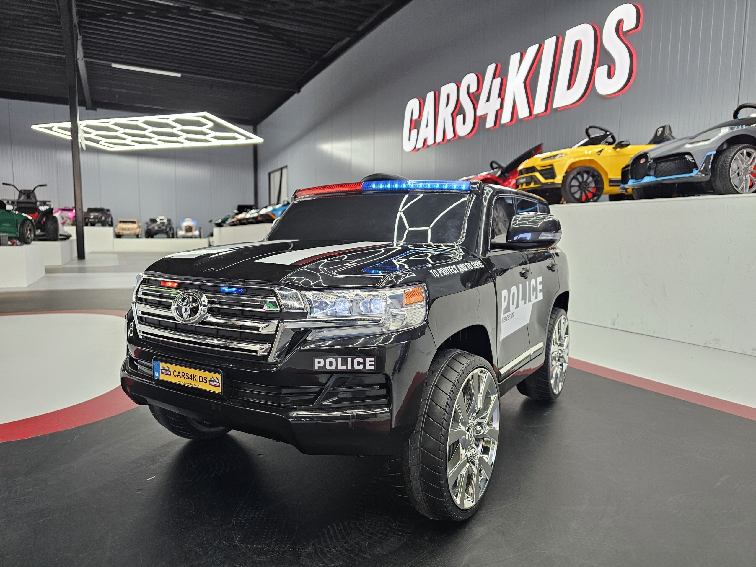 Kinderauto Toyota Land Cruiser politie 24 volt